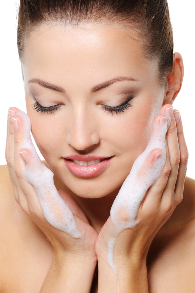 woman washing her face