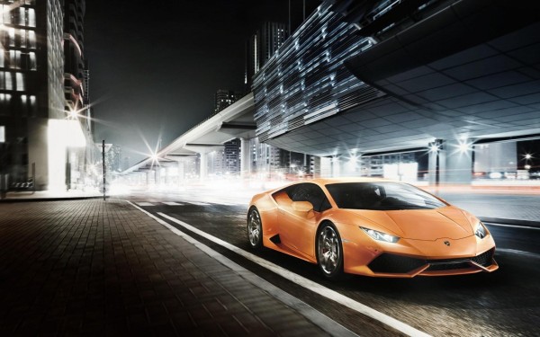 Car wallpaper: Lamborghini Huracan LP 610-4 (orange) driving through city streets car wallpaper Lamborghini Huracán LP 610-4: 21 Car Wallpapers car wallpaper lamborghini huracan lp 610 4 wallpaper background orange front right view city streets