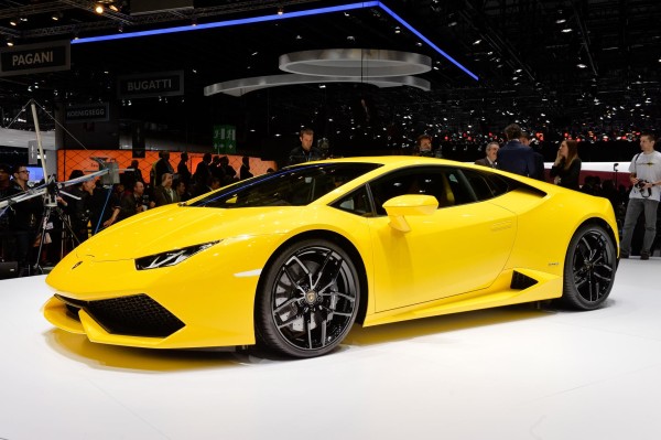 Car wallpaper: Lamborghini Huracan LP 610-4 on car exhibition stand (yellow) front left view car wallpaper Lamborghini Huracán LP 610-4: 21 Car Wallpapers car wallpaper lamborghini huracan lp 610 4 wallpaper background yellow front left view on exhibition