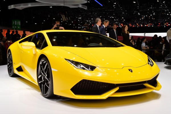 Car wallpaper: Lamborghini Huracan LP 610-4 on car exhibition stand (yellow) front right view car wallpaper Lamborghini Huracán LP 610-4: 21 Car Wallpapers car wallpaper lamborghini huracan lp 610 4 wallpaper background yellow front right closeupview on exhibition