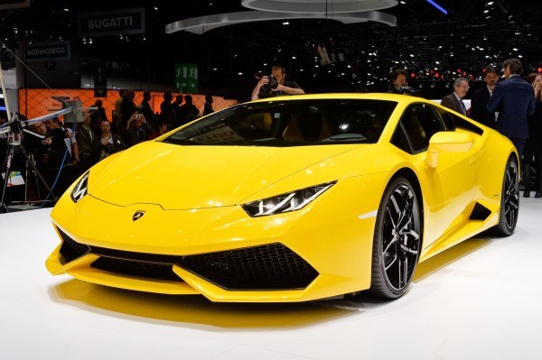Car wallpaper: Lamborghini Huracan LP 610-4 on car exhibition stand (yellow) front left view car wallpaper Lamborghini Huracán LP 610-4: 21 Car Wallpapers car wallpaper lamborghini huracan lp 610 4 wallpaper background yellow front rleft closeup view on exhibition