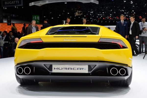Car wallpaper: Lamborghini Huracan LP 610-4 on car exhibition stand (yellow) rear view car wallpaper Lamborghini Huracán LP 610-4: 21 Car Wallpapers car wallpaper lamborghini huracan lp 610 4 wallpaper background yellow rear view on exhibition